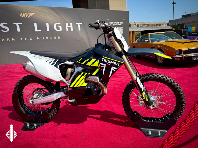 Triumph TF 250X motorcycle on display at the 007: First Light booth by IO Interactive during Gamescom 2025.