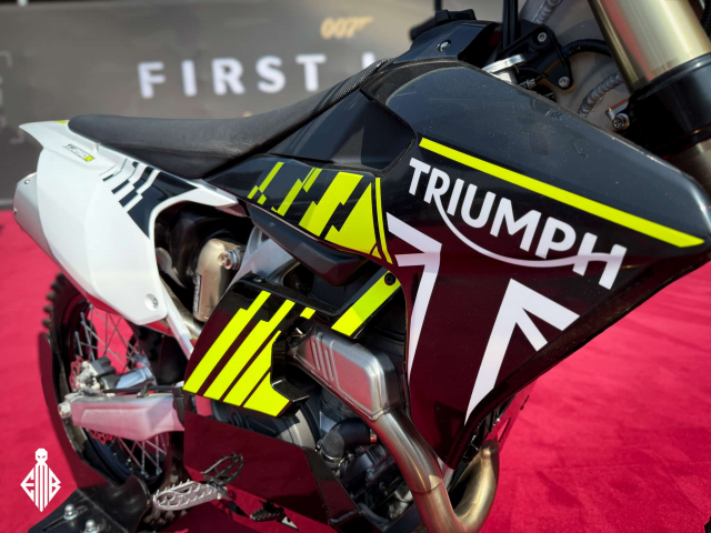 Triumph TF 250X motorcycle on display at the 007: First Light booth by IO Interactive during Gamescom 2025.