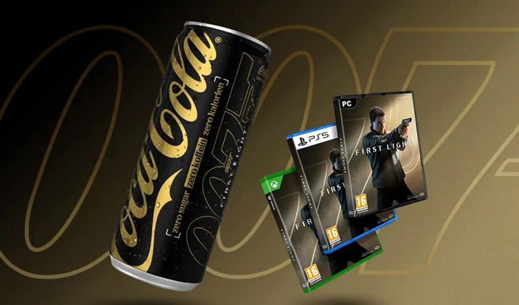 Limited-edition Coca-Cola Zero Sugar Zero Caffeine can with 007 branding, shown alongside boxed copies of the video game “007: First Light” for PlayStation 5, Xbox Series X|S, and PC on a gold-toned background.