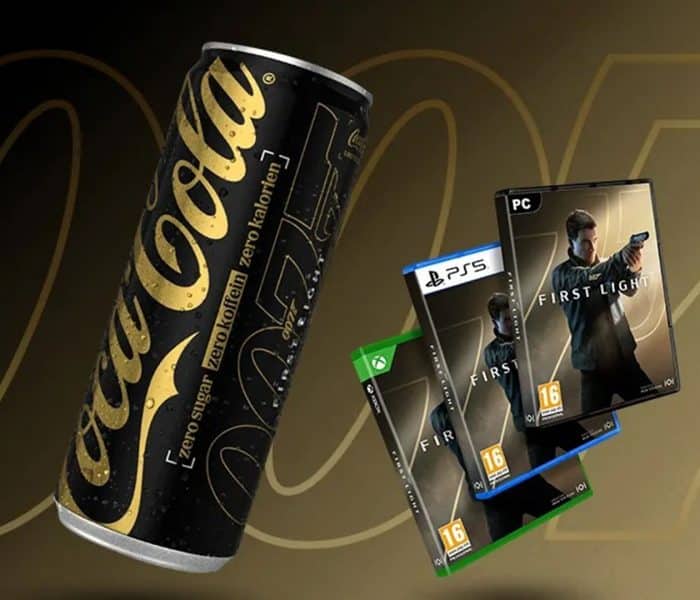 Limited-edition Coca-Cola Zero Sugar Zero Caffeine can with 007 branding, shown alongside boxed copies of the video game “007: First Light” for PlayStation 5, Xbox Series X|S, and PC on a gold-toned background.