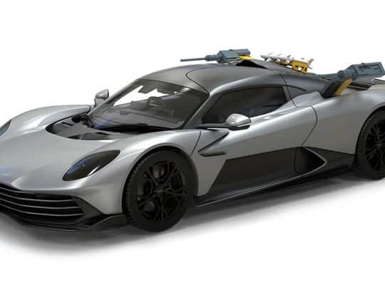 Aston Martin Valhalla die-cast model from 007: First Light by Corgi, shown with roof-mounted missiles and deployed weapon systems.