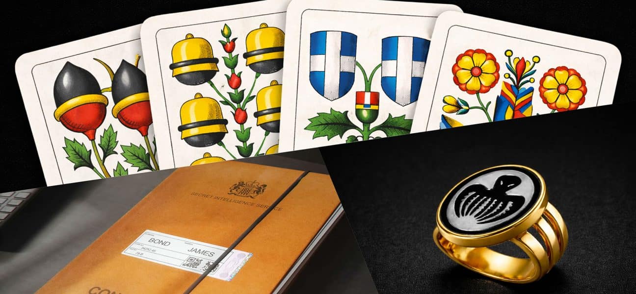 Confidential MI6 file for James Bond, Swiss-German Jass playing cards, and a gold Spectre ring featuring the iconic octopus symbol in 007 First Light